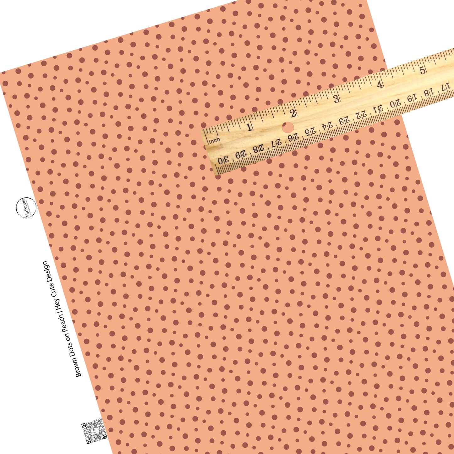 These dot themed light orange faux leather sheets contain the following design elements: small dark orange and brown dots on light peach.