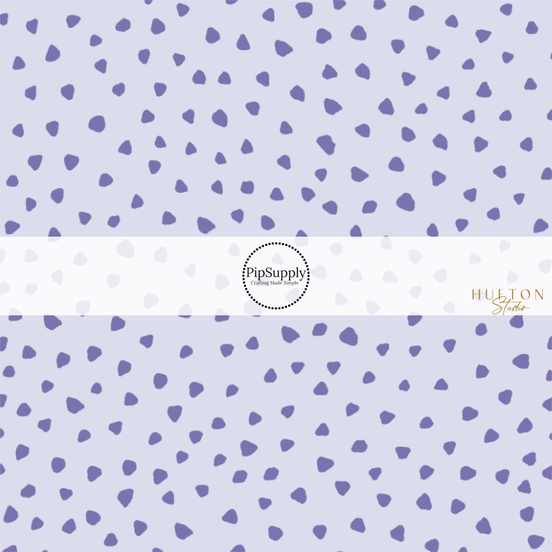 These dot themed light purple fabric by the yard features dark purple small dots on pale purple. This fun dot themed fabric can be used for all your sewing and crafting needs! 