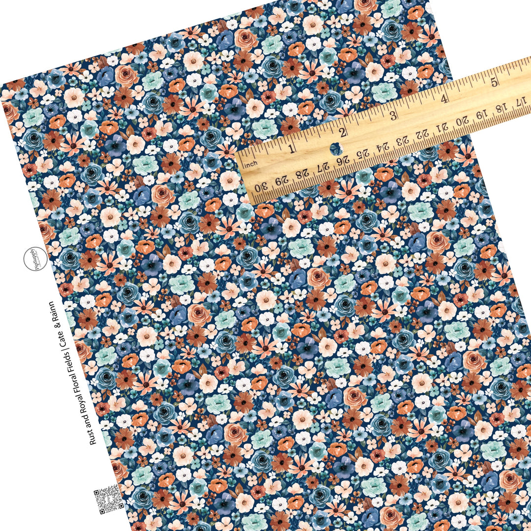 These floral themed royal blue faux leather sheets contain the following design elements: cream, light pink, orange, teal, and blue watercolor floral flowers on dark blue. Our CPSIA compliant faux leather sheets or rolls can be used for all types of crafting projects. 