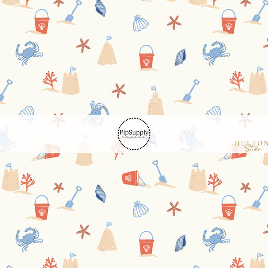 This summer fabric by the yard features sand castles and crabs. This fun themed fabric can be used for all your sewing and crafting needs!