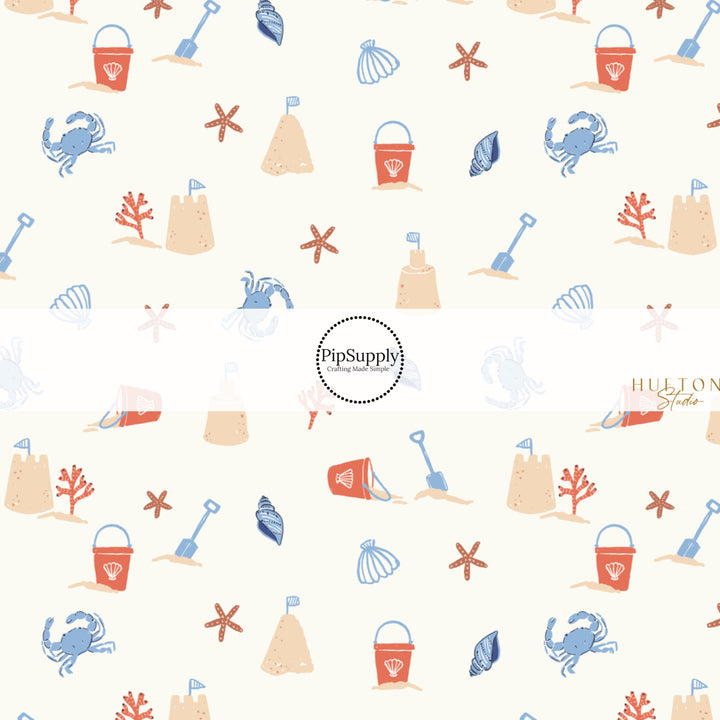 This summer fabric by the yard features sand castles and crabs. This fun themed fabric can be used for all your sewing and crafting needs!