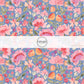 This summer fabric by the yard features multi colored flowers on blue. This fun summer themed fabric can be used for all your sewing and crafting needs!