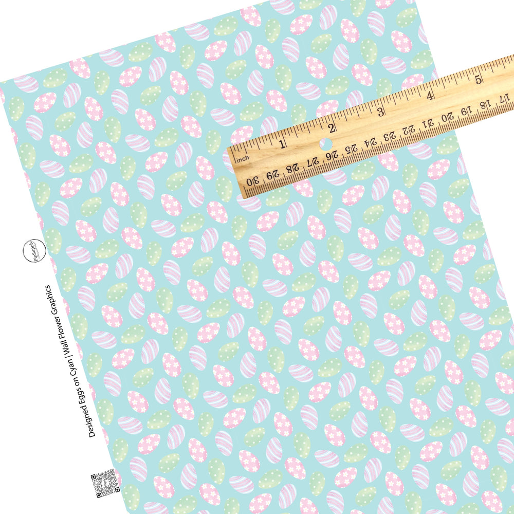 These spring pattern themed faux leather sheets contain the following design elements: pastel colored Easter eggs with stripes and flowers on light blue. Our CPSIA compliant faux leather sheets or rolls can be used for all types of crafting projects.