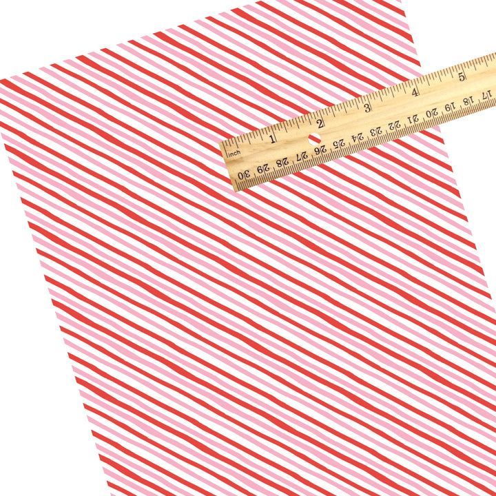 These winter stripe themed pattern faux leather sheets contain the following design elements: Christmas colorful diagonal stripes. Our CPSIA compliant faux leather sheets or rolls can be used for all types of crafting projects.