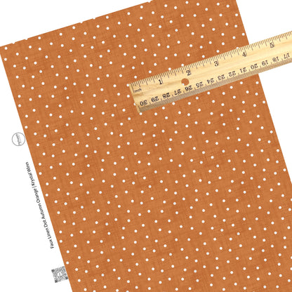White polka dots on distressed orange faux leather sheets