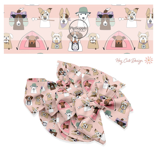 These camping dog outdoor themed light pink no sew bow strips can be easily tied and attached to a clip for a finished hair bow. These fun animal bow strips with light pink dog pattern features a variety of different dog faces with hats, smores, and tents on pink are great for personal use or to sell.