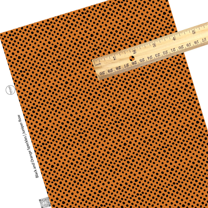 Scattered black dots on orange faux leatehr sheets