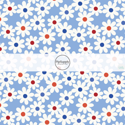 This 4th of July fabric by the yard features daisies on blue. This fun patriotic themed fabric can be used for all your sewing and crafting needs!