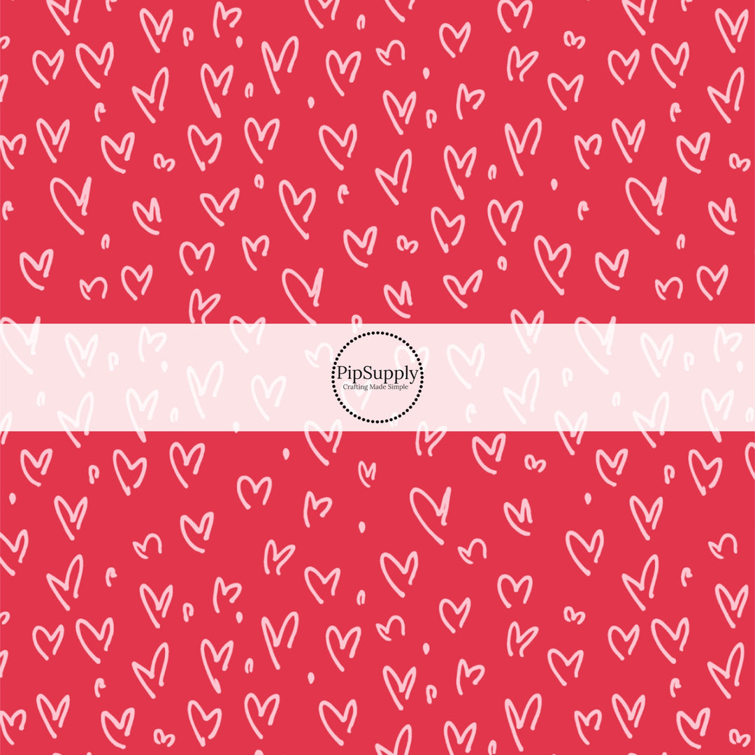 This holiday fabric by the yard features doodle hearts on red. This festive pattern fabric can be used for all your sewing and crafting needs!