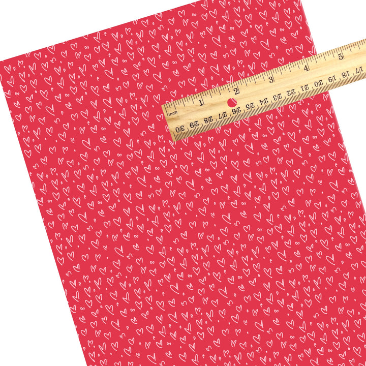 These holiday faux leather sheets contain the following design elements: doodle hearts on red. Our CPSIA compliant faux leather sheets or rolls can be used for all types of crafting projects.