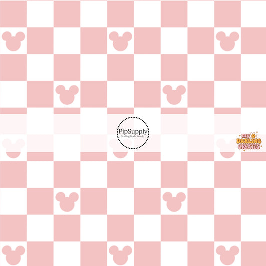 This magical inspired fabric by the yard features the following design: dusty pink and cream checker pattern with mouse ears. This fun themed fabric can be used for all your sewing and crafting needs!