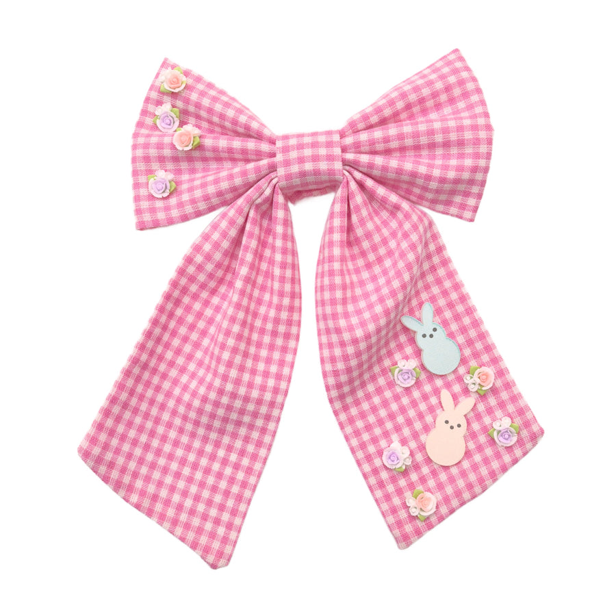 These spring pink gingham tied bows are ready to package and resell to your customers no sewing or measuring necessary! These hair bows come with a alligator clip already attached. There are Easter embellishments of bunnies and spring flowers.