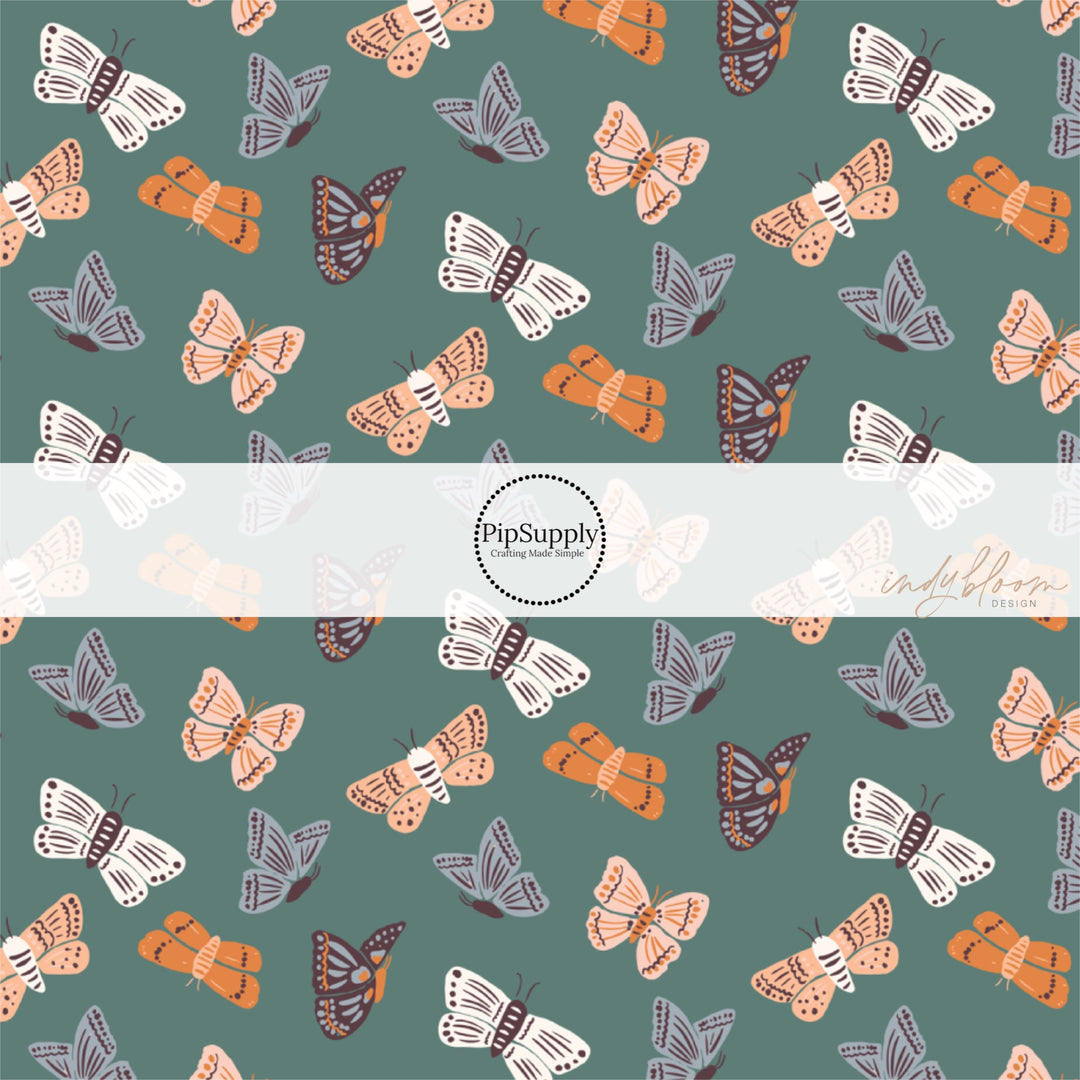 This summer fabric by the yard features colorful butterflies on teal. This fun summer themed fabric can be used for all your sewing and crafting needs!