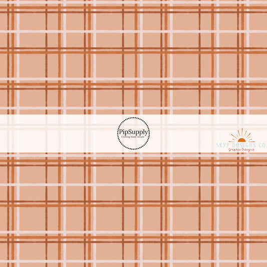 These autumn themed pattern fabric by the yard features the following design elements: fall plaid pattern. This fun themed fabric can be used for all your sewing and crafting needs.