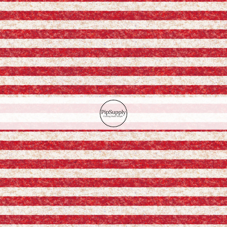 These patriotic fabric by the yard features red stripes. This fun pattern fabric can be used for all your sewing and crafting needs!