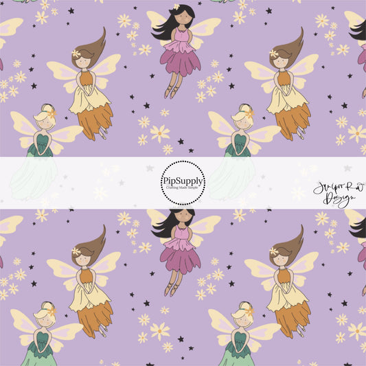 These enchanted fairies themed light purple fabric by the yard features small stars, cream daisies, and fairies. 