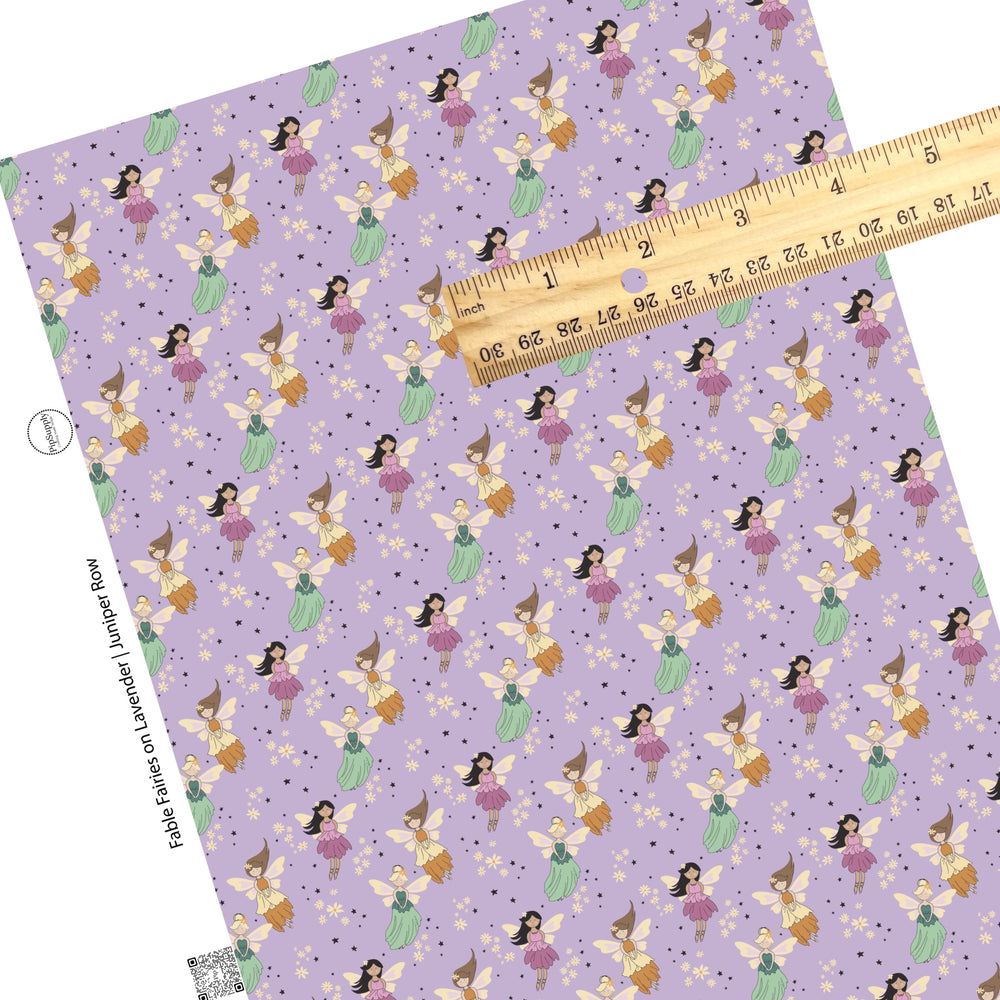 These enchanted fairies themed light purple faux leather sheets contain the following design elements: small stars, cream daisies, and fairies. 