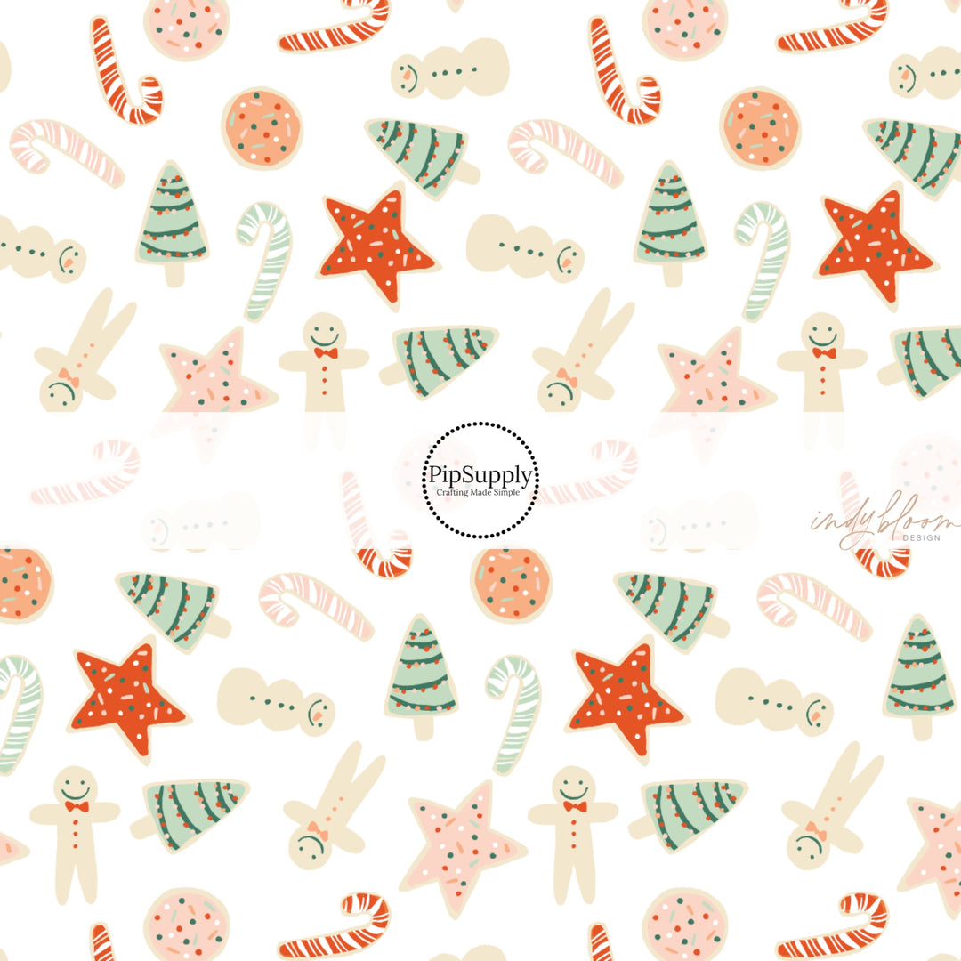 These Christmas treat themed pattern fabric by the yard features the following design elements: cookies and candy canes on cream. This fun themed fabric can be used for all your sewing and crafting needs!