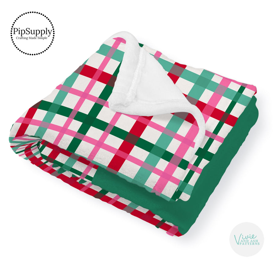 This winter designer pattern is printed onto the front side of our soft touch minky blankets. The backside will not be printed and left the natural cream/white color of the blanket. This print pattern features colorful Christmas gingham pattern.