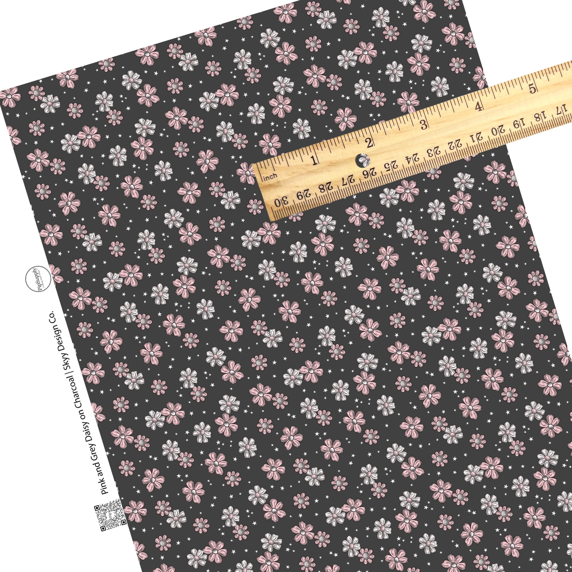 Scattered stars and flowers on charcoal faux leather sheets