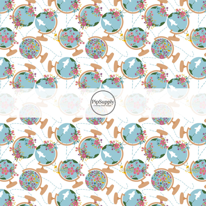 These travel themed fabric by the yard features floral world globes pattern. This fun pattern fabric can be used for all your sewing and crafting needs!