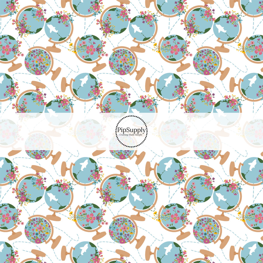 These travel themed fabric by the yard features floral world globes pattern. This fun pattern fabric can be used for all your sewing and crafting needs!