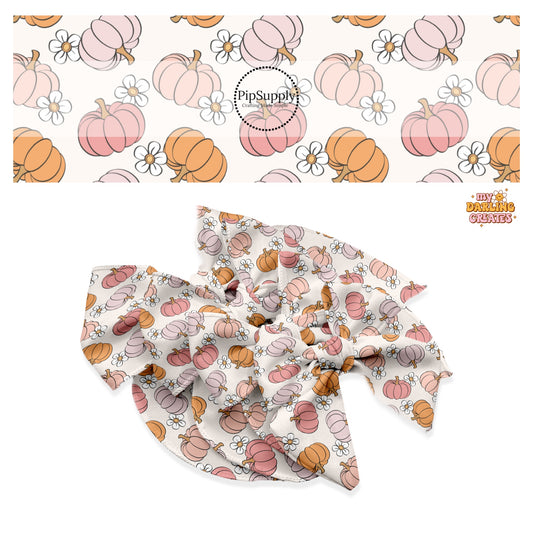 White flower with multi pumpkins on cream hair bow strips