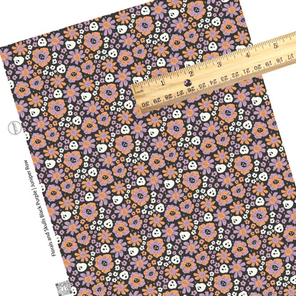 Purple and orange flowers with white skulls on black faux leather sheets