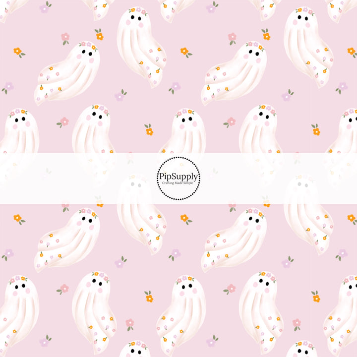 These spooky themed pattern fabric by the yard features the following design elements: ghost with flowers on pink. This fun themed fabric can be used for all your sewing and crafting needs!