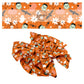 Floral spiders, frank, ghouls, and pumpkins on orange hair bow strips