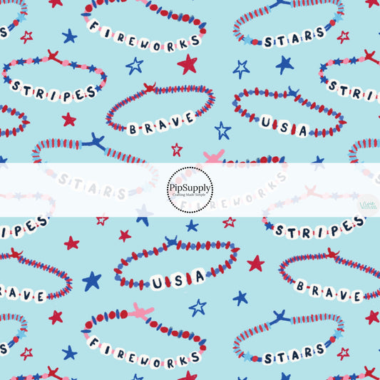 This 4th of July fabric by the yard features patriotic friendship bracelets on blue. This fun patriotic themed fabric can be used for all your sewing and crafting needs!