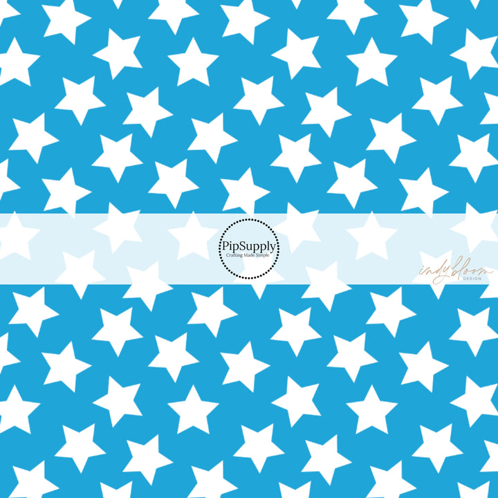 This 4th of July fabric by the yard features patriotic white stars on blue. This fun patriotic themed fabric can be used for all your sewing and crafting needs!