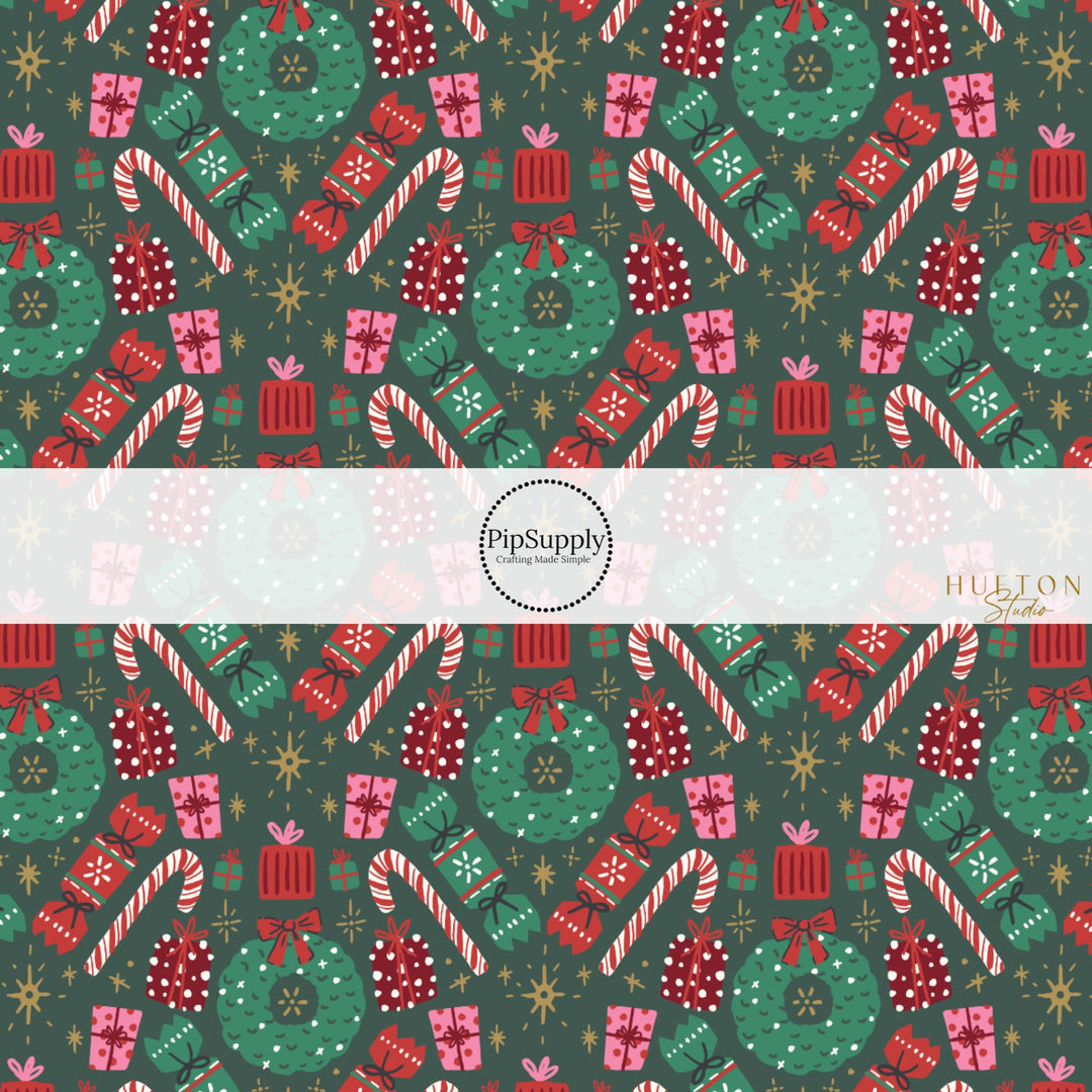 These Christmas themed pattern fabric by the yard features the following design elements: holiday wreaths, candy canes, and presents on green. This fun themed fabric can be used for all your sewing and crafting needs!