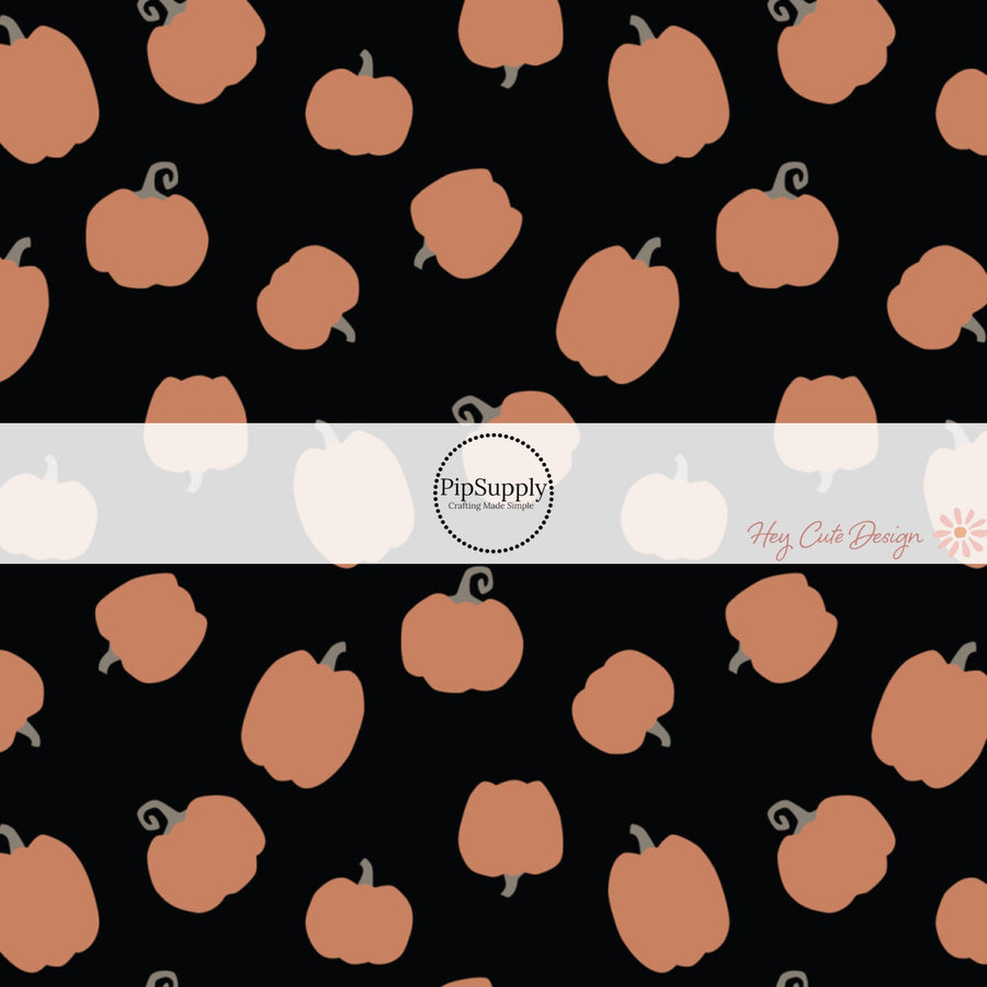 These Halloween themed pattern fabric by the yard features the following design elements: orange gourds on black. This fun spooky themed fabric can be used for all your sewing and crafting needs!