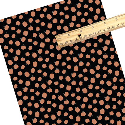 These Halloween themed pattern faux leather sheets contain the following design elements: orange gourds on black. Our CPSIA compliant faux leather sheets or rolls can be used for all types of crafting projects.