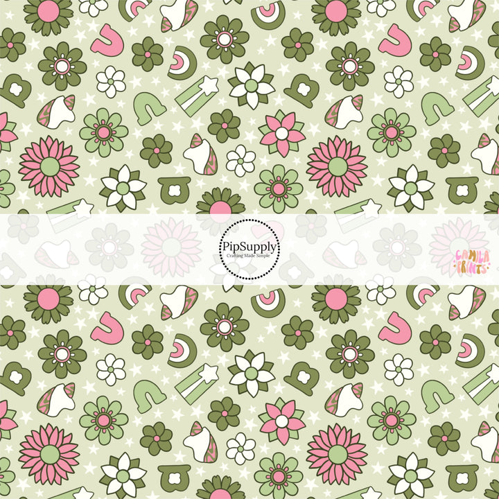 This holiday fabric by the yard features shamrocks, flowers, and charms on green. This festive pattern fabric can be used for all your sewing and crafting needs!