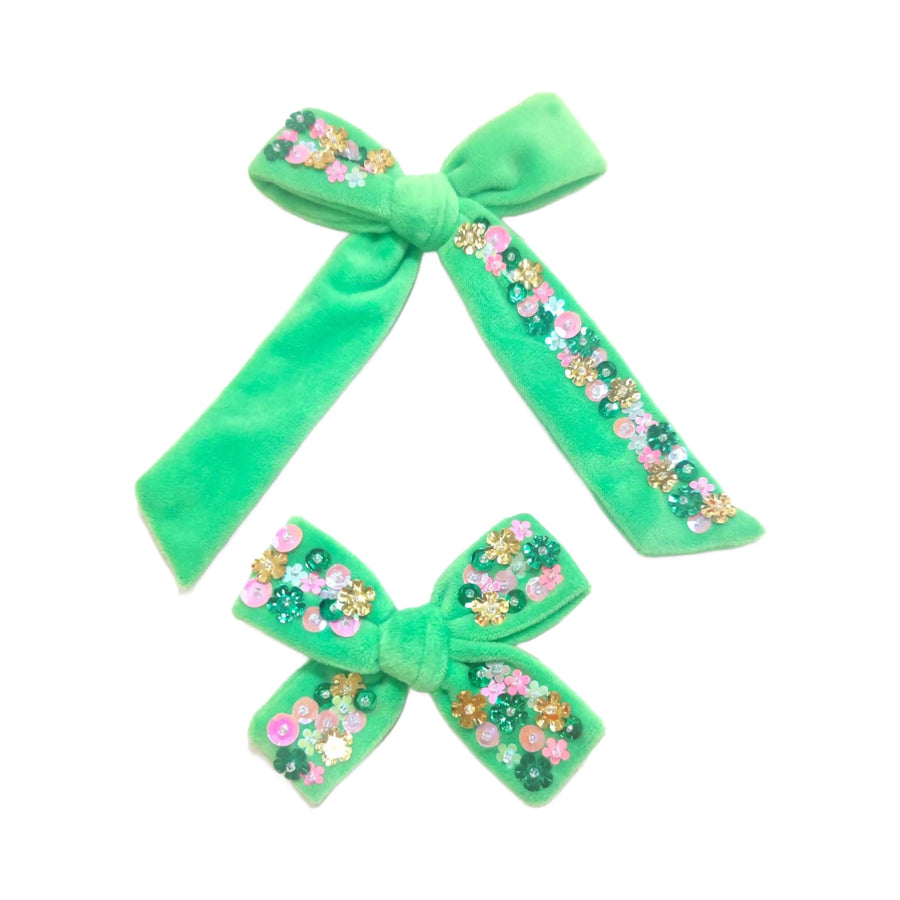 These spring green velvet multi sequin tied bows are ready to package and resell to your customers no sewing or measuring necessary! These hair bows come with a alligator clip already attached. Along with multi color floral sequins.