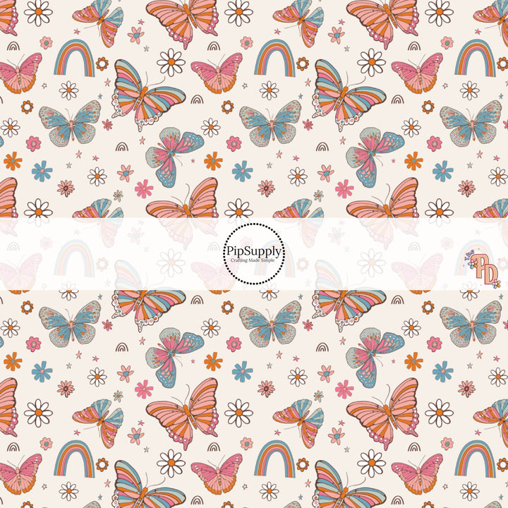 This summer fabric by the yard features multi colored butterflies surrounded by rainbows and daisies. This fun summer themed fabric can be used for all your sewing and crafting needs!