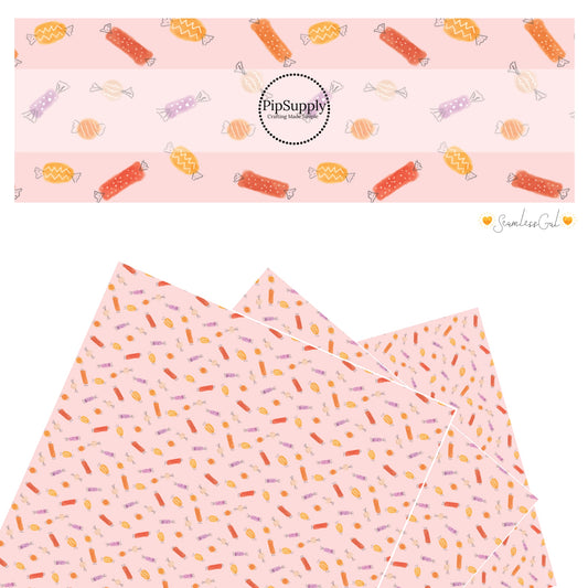 Scattered multi candy on pink faux leather sheets