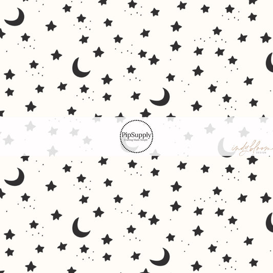 These Halloween themed pattern fabric by the yard features the following design elements: stars and moons on cream. This fun spooky themed fabric can be used for all your sewing and crafting needs!