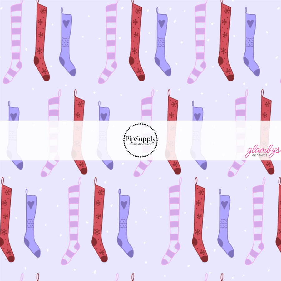 These Christmas themed pattern fabric by the yard features the following design elements: colorful Christmas stockings on purple. This fun themed fabric can be used for all your sewing and crafting needs!