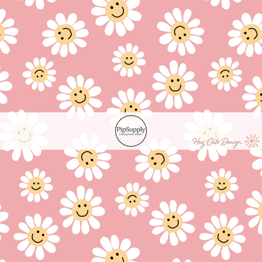 This summer fabric by the yard features smiley faces on daises on pink. This fun summer themed fabric can be used for all your sewing and crafting needs!