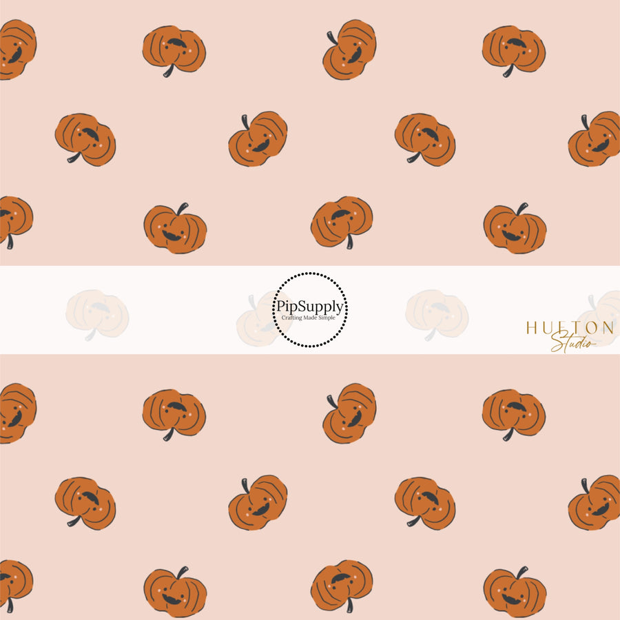 These Halloween themed pattern fabric by the yard features the following design elements: orange pumpkins on light pink. This fun spooky themed fabric can be used for all your sewing and crafting needs!