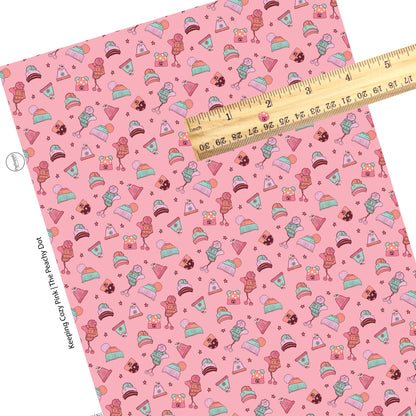 Scattered hats with patterns on pink faux leather sheets