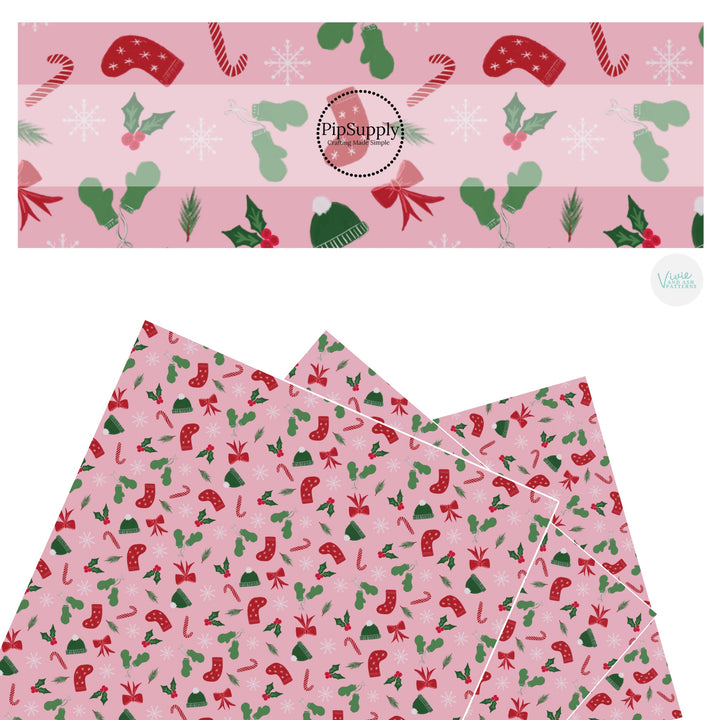 Red bows, mittens, stockings, hats, and holly on pink faux leather sheets