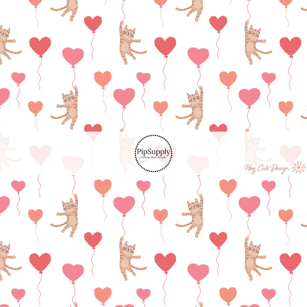 This holiday fabric by the yard features colorful heart balloons and kittens. This festive pattern fabric can be used for all your sewing and crafting needs!