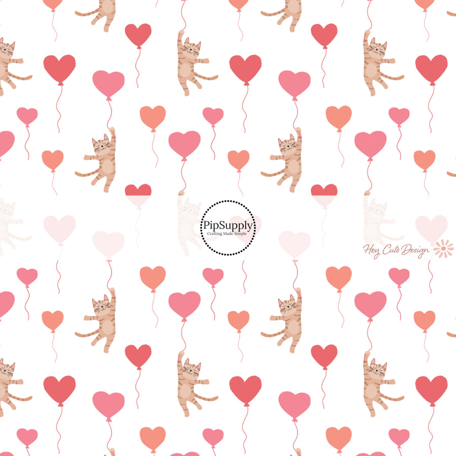 This holiday fabric by the yard features colorful heart balloons and kittens. This festive pattern fabric can be used for all your sewing and crafting needs!