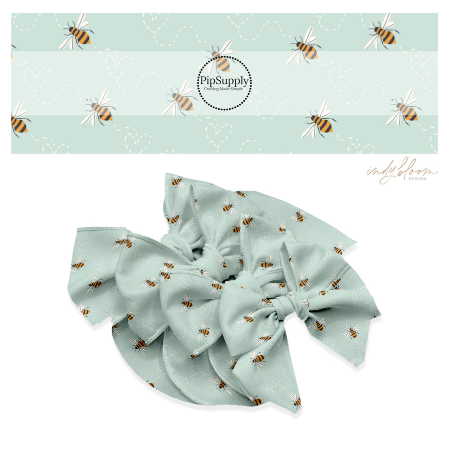 Bumble bees with heart traces on aqua hair bow strips