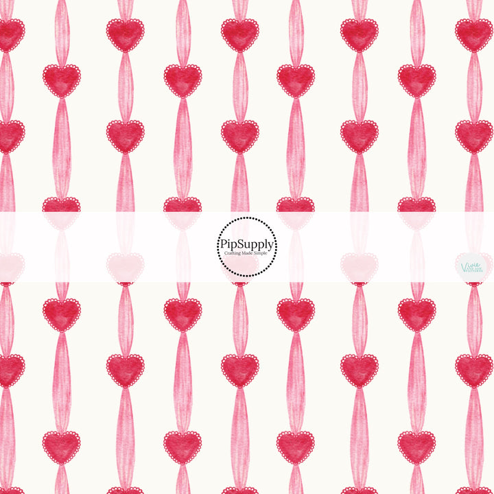 This holiday fabric by the yard features Valentine hearts and stripes. This festive pattern fabric can be used for all your sewing and crafting needs!