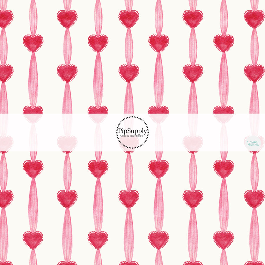 This holiday fabric by the yard features Valentine hearts and stripes. This festive pattern fabric can be used for all your sewing and crafting needs!